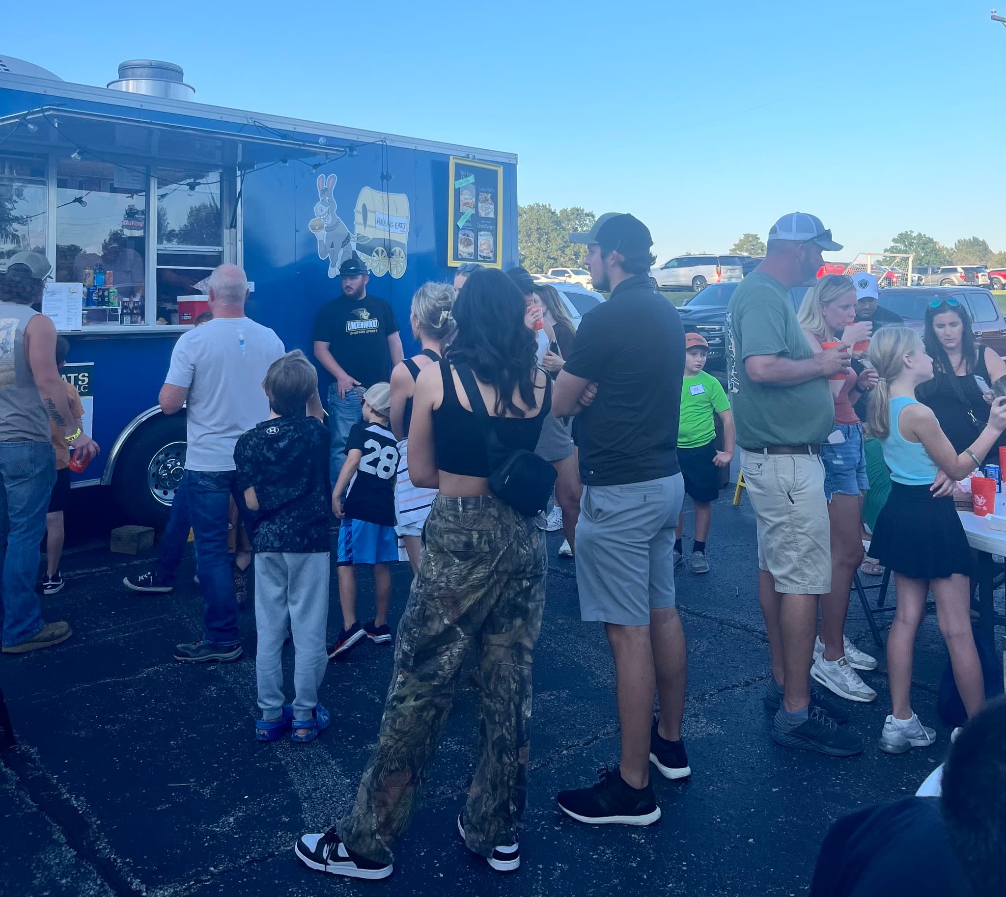 Customers lined up at the Hauling Eats trailer