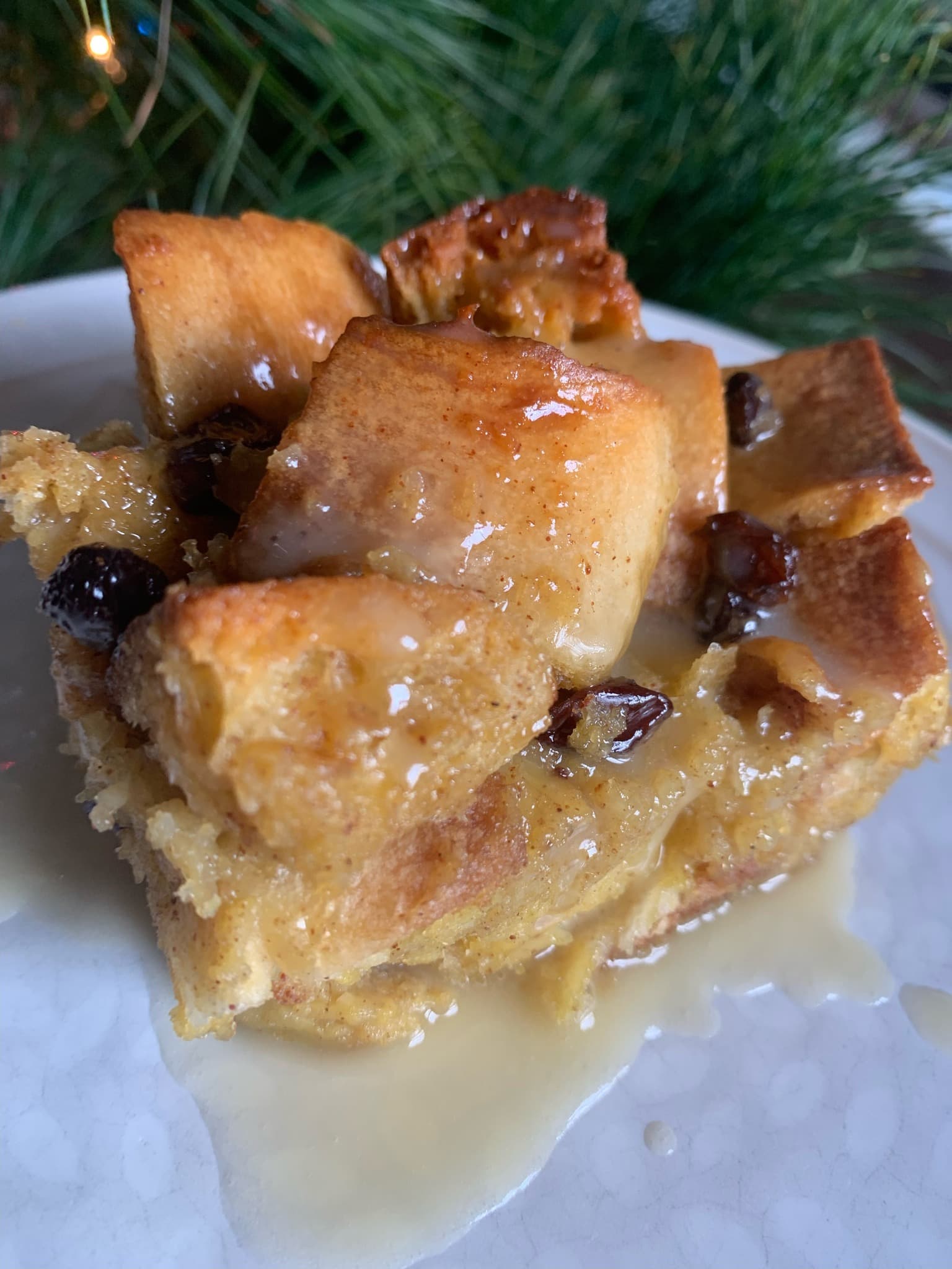 Bread pudding with vanilla sauce, holiday setting