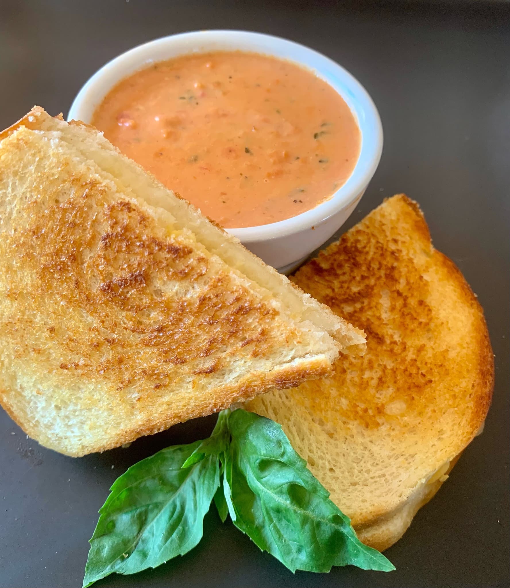 Grilled cheese sandwich with creamy tomato basil soup